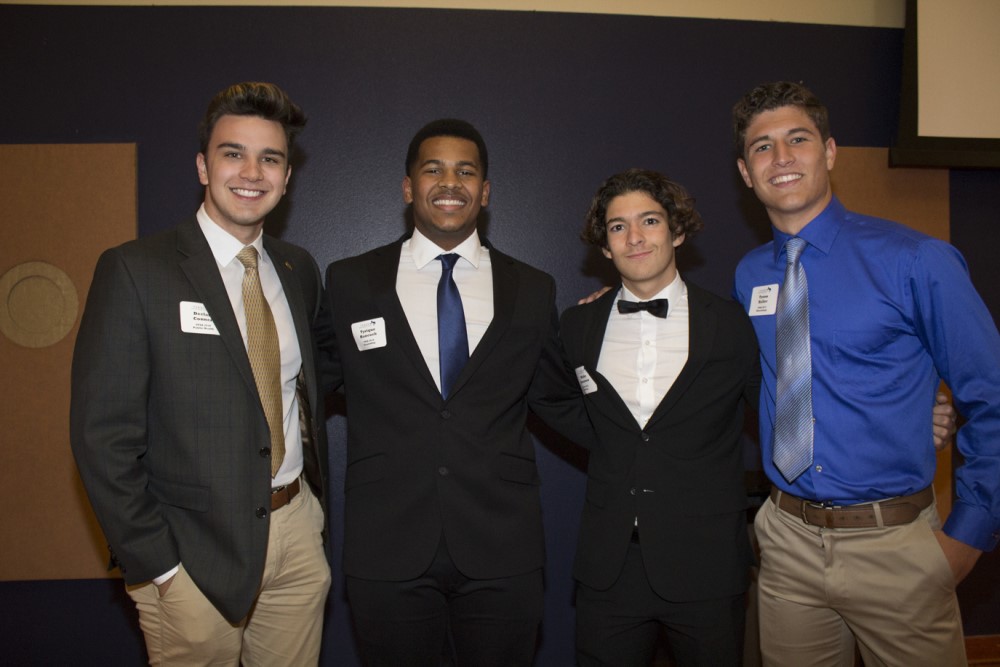 A group of Terry Scholars pose for a picture at the annual Terry Banquet event on-campus.